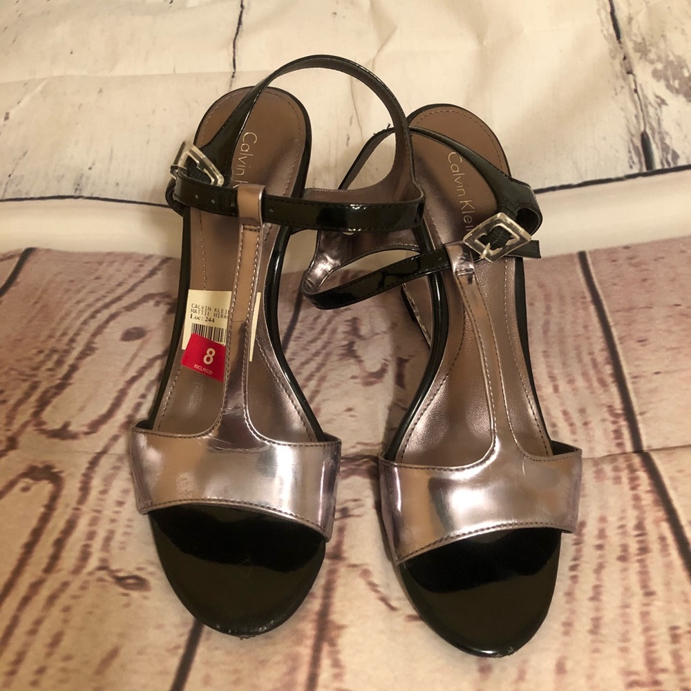 Closet blowout Calvin Klein Silver wedges. Size 8.